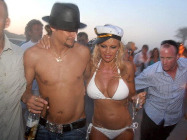 Pamela Anderson shares a drink with her husband, US musician Kid Rock on their wedding day in Saint-Tropez, southern France.