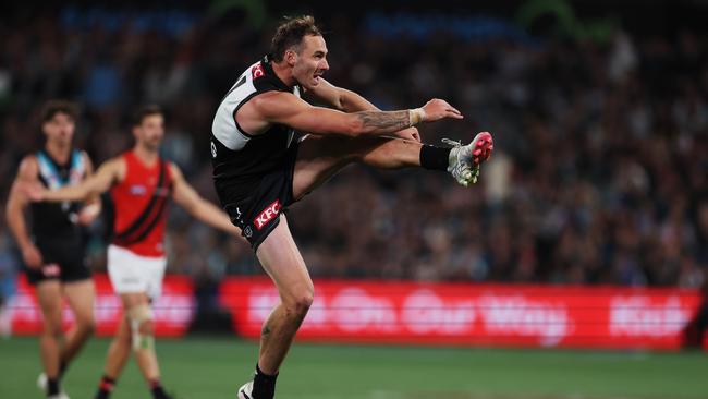 ADELAIDE, AUSTRALIA – APRIL 05: Jeremy Finlayson of the Power kicks the ball during the 2024 AFL Round 04 match between the Port Adelaide Power and the Essendon Bombers at Adelaide Oval on April 05, 2024 in Adelaide, Australia. (Photo by James Elsby/AFL Photos via Getty Images)