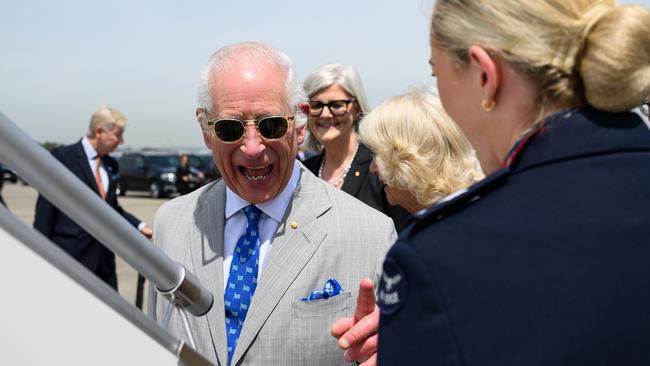 King Charles shares a laugh with airline staff as he departs Australia. Picture: NewsWire / Bianca De Marchi