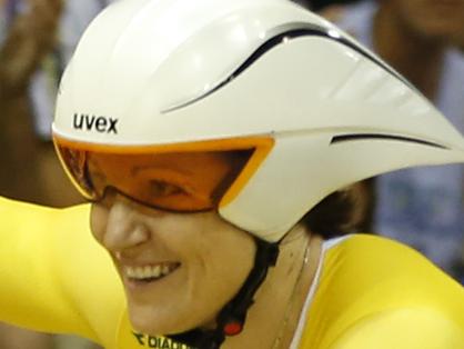 Australia's track cyclist Anna Meares waves to the crowd as she celebrates after winning the women's 500 meter time trial in the Chris Hoy velodrome at the Commonwealth Games 2014 in Glasgow, Scotland, Thursday July 24, 2014. (AP Photo/Alastair Grant)