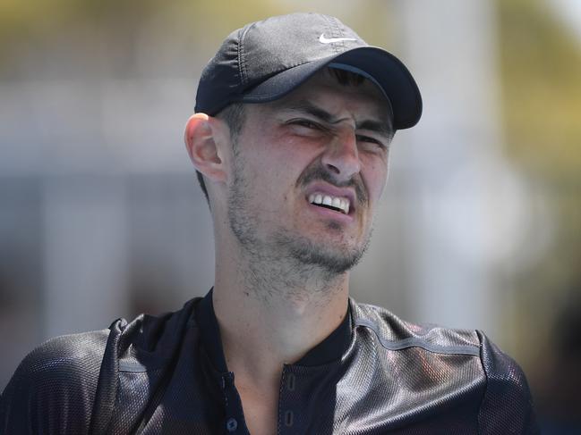 Bernard Tomic of Australia reacts against Lorenzo Sonego of Italy during qualifying round 3 for the Australian Open tennis tournament, Sunday, January 14, 2018. (AAP Image/Julian Smith) NO ARCHIVING, EDITORIAL USE ONLY