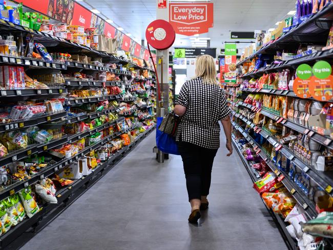 SYDNEY, AUSTRALIA - SEPTEMBER 05: An aisle of products in a Woolworths Supermarket on September 05, 2024 in Sydney, Australia. Australia is currently facing a severe cost of living crisis, with rising prices for essentials like food, housing, and utilities significantly outpacing wage growth, leaving many households struggling to make ends meet. While over 3.3 million Australians live in poverty, supermarket giants and banks are reporting record profits, highlighting a stark contrast between corporate gains and the financial hardship experienced by everyday citizens. This situation poses serious challenges across the nation, as people navigate the pressures of high inflation and inadequate support. (Photo by James Gourley/Getty Images)