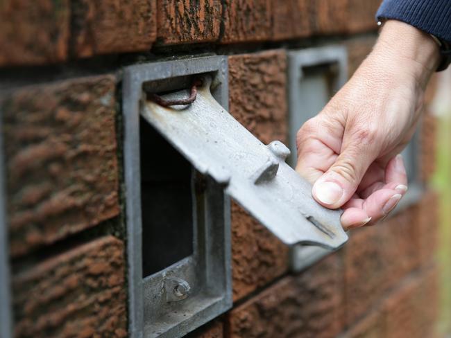 Police showing how easy it is for letterbox thefts, most commonly unlocked or to small for letters.