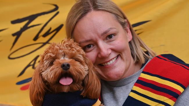 11/4/24. The Crows have the most dog and cat owners than any AFL club. Crow family Mum Erin Sugars with kids Zoe, 5, Jack, 3 and Dean, 1 and their pet Cavoodle, Lizzie. Lizzie (dog) and Erin  Picture: Keryn Stevens