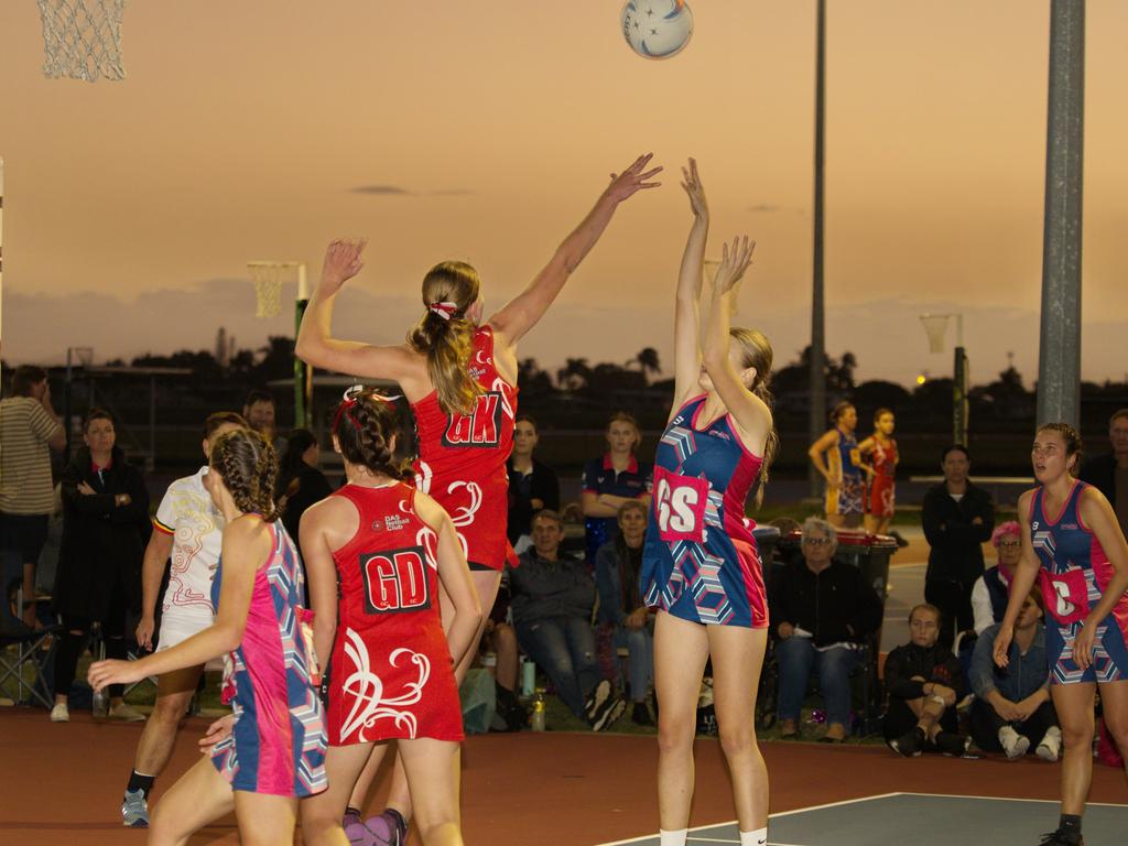 A constant battle between Lulu Milfullt and Phoebe Frances in the evening glow in the 2021 Mackay Netball Association seniors grand final. September 4th, 2021 Picture: Marty Strecker