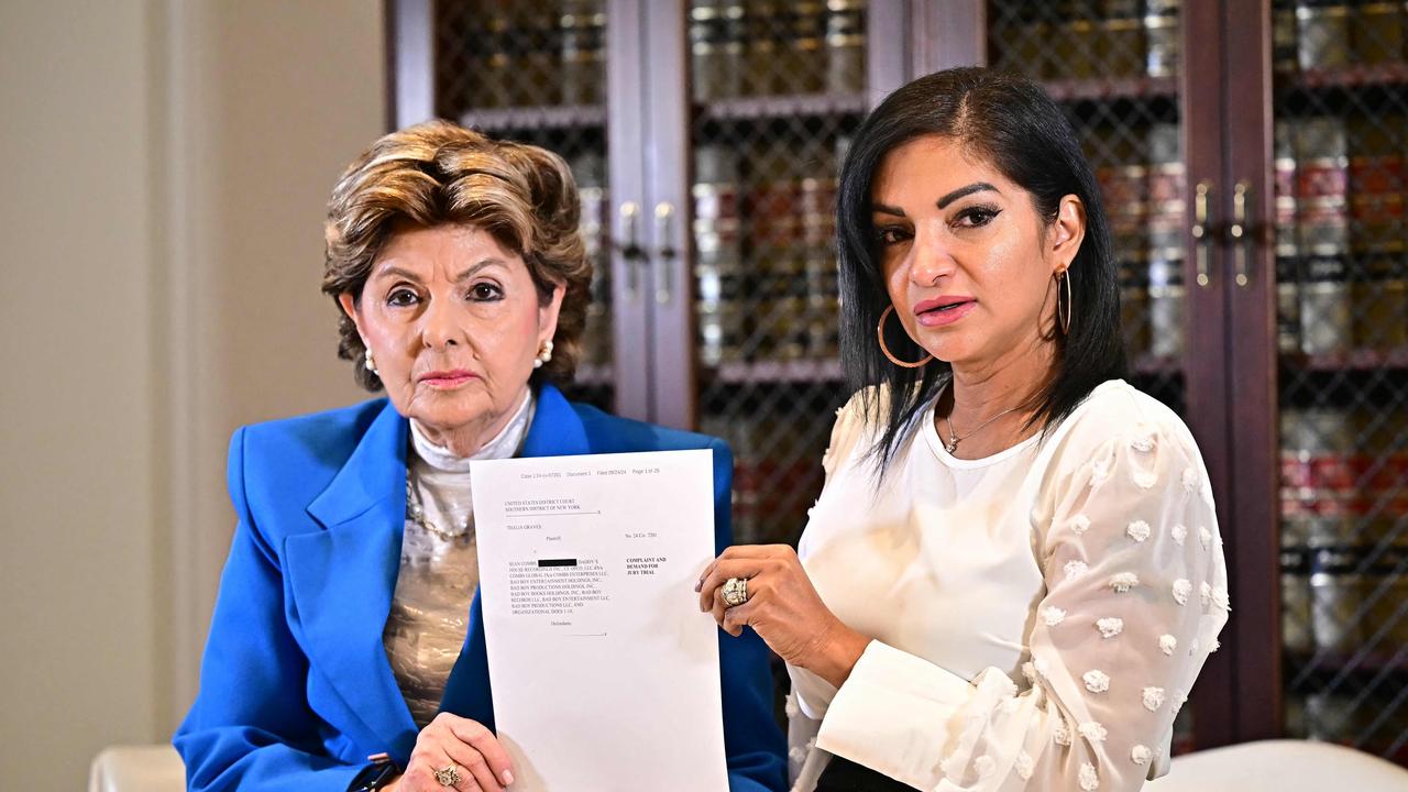 Attorney Gloria Allred and Thalia Graves, an alleged victim of Sean Diddy Combs, hold a copy of a criminal complaint during a press conference in Los Angeles on September 24. Picture: AFP