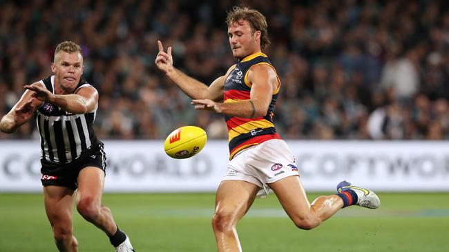 Luke Pedlar kicks the ball during the Showdown. Picture: Sarah Reed/AFL Photos via Getty