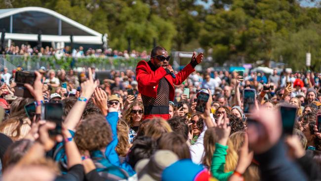 Genesis Owusu performing amid the crowd on Sunday. Picture: Topbunk