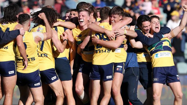 Woodville-West Torrens players celebrate their premiership. Picture: Sarah Reed