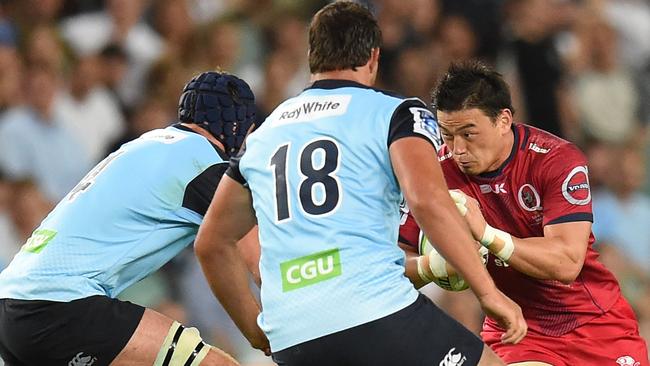 Reds signing Ayumu Goromaru runs into the Waratahs defence of Dean Mumm and Jeremy Tilse during their Round 1 Super Rugby clash. Picture: AAP