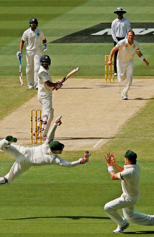 2014: Got him! Australian wicketkeeper Brad Haddin takes a spectacular catch to dismiss India’s Cheteshwar Pujara off Ryan Harris on day three of the third Test at the MCG. Picture: Colleen Petch