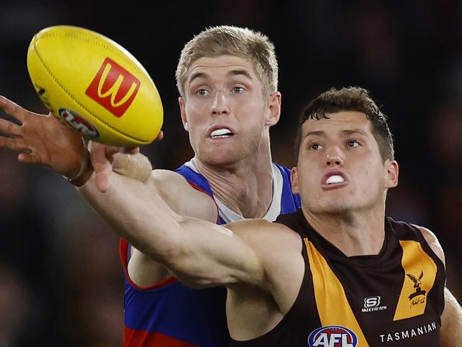 MELBOURNE , AUSTRALIA. May 4, 2024.  AFL Round 8. . Western Bulldogs vs Hawthorn at Marvel Stadium.  Lloyd Meek of the Hawks and Bulldog Tim English battle in the ruck    . Pic: Michael Klein