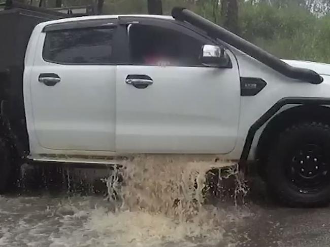 Hefty fine after man, dog towed out of floodwaters