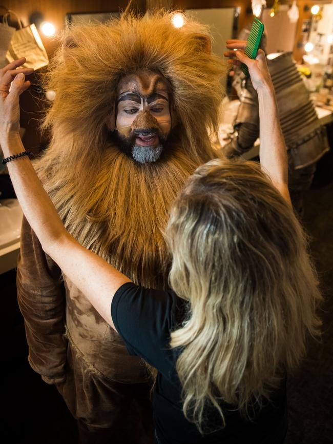 John Xintavelonis, who plays the lion, assisted by crew member Sharon Case in his dressing room. Picture: Tom Huntley