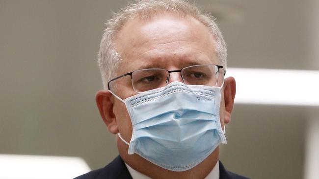 SYDNEY, AUSTRALIA - AUGUST 19: Prime Minister Scott Morrison is seen wearing a face mask during a press conference at AstraZeneca on August 19, 2020 in Sydney, Australia.  The Australian government has announced an agreement with the British pharmaceutical giant AstraZeneca to secure at least 25 million doses of a COVID-19 vaccine if it passes clinical trials.  The University of Oxford COVID-19 vaccine is currently in phase-three testing. If the vaccine proves to be successful, Australia will manufacture and supply vaccines and will be made available for free. The project could deliver the first vaccines by the end of this year or by early 2021. (Photo by Lisa Maree Williams/Getty Images)