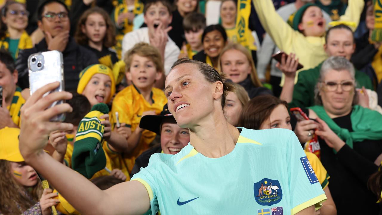 BRISBANE, AUSTRALIA – AUGUST 19: Emily Van-Egmond of Australia takes a selfie with fans after the FIFA Women's World Cup Australia &amp; New Zealand 2023 Third Place Match match between Sweden and Australia at Brisbane Stadium on August 19, 2023 in Brisbane, Australia. (Photo by Cameron Spencer/Getty Images)