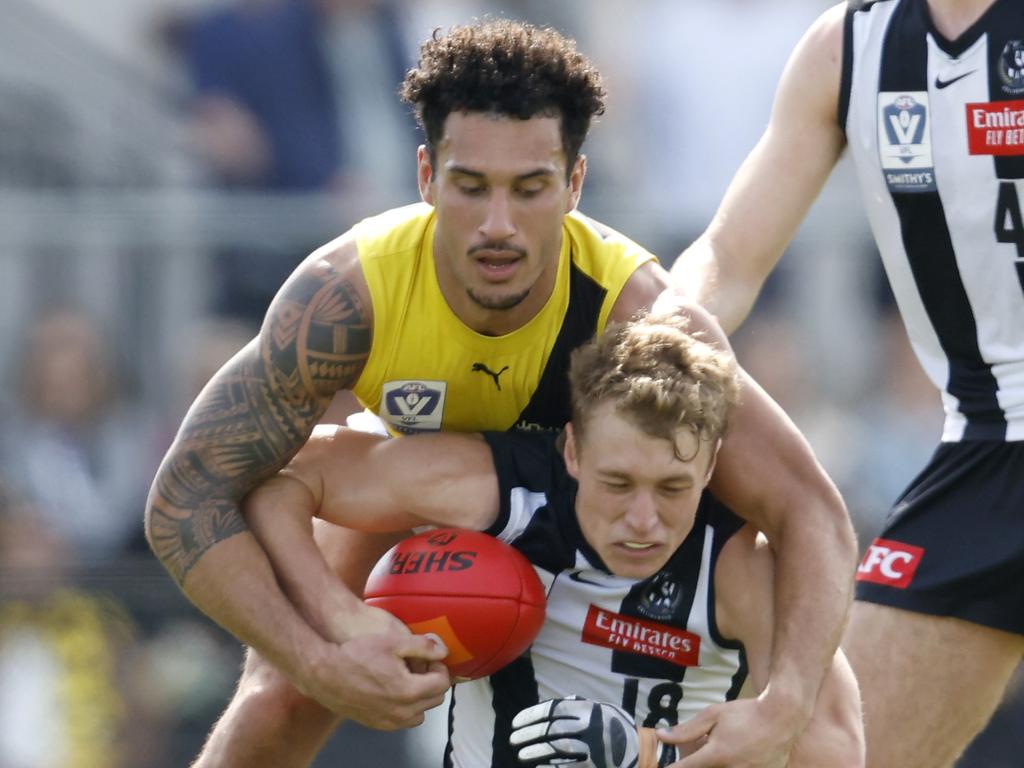 MELBOURNE, AUSTRALIA - AUGUST 27: Mykelti Lefau of the Tigers tackles Finlay Macrae of Collingwood during the VFL Wildcard Round match between Collingwood and Richmond at The Swinburne Centre on August 27, 2023 in Melbourne, Australia. (Photo by Darrian Traynor/AFL Photos/via Getty Images)