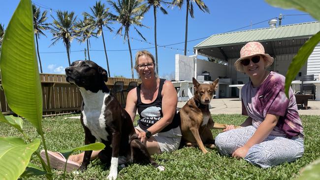 Rose Bay Beach Caravan Park owner Bernie Mackie with guest Sarona Morgan - with them is Ms Mackie’s dogs Malie and Ellie.