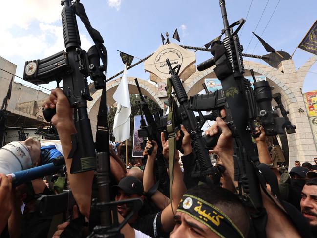 Palestinian militants carry the body of 19-year-old Ahmad Awawda who was killed in clashes with Israeli troops in the occupied West Bank region of Nablus. Picture: AFP