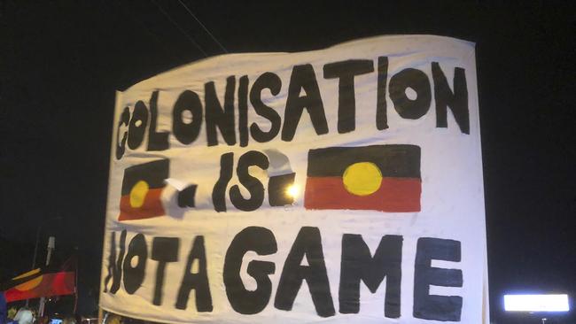 A small group of indigenous protesters blocked a Gold Coast road, bringing a temporary halt to the Queen's Baton Relay. Picture: AP