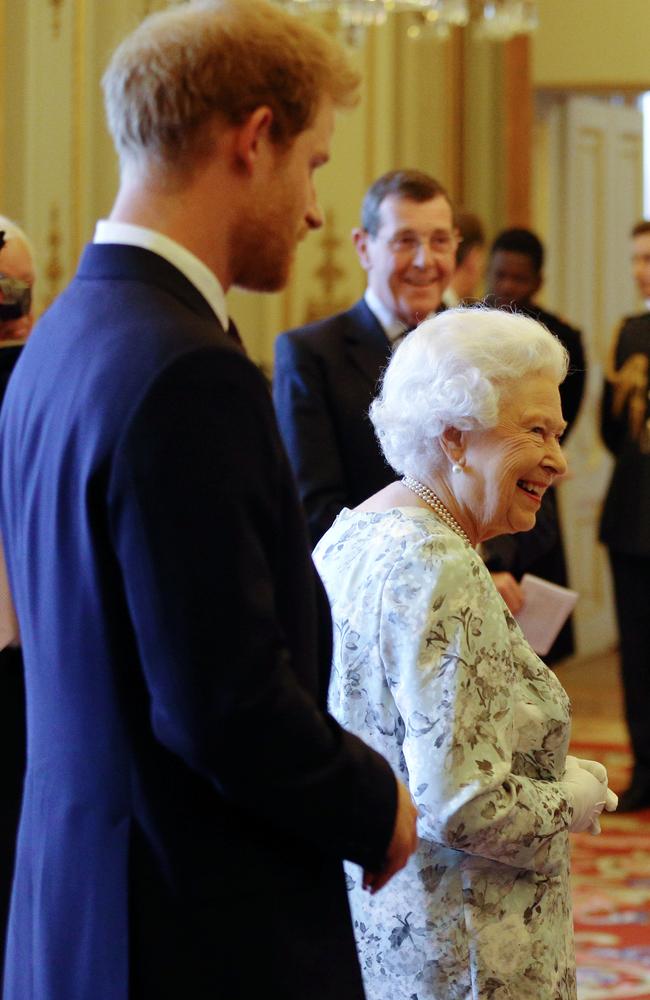 Queen Elizabeth II and 's Prince Harry greet guests during a reception prior to the Queen's Young Leaders Awards ceremony. Picture: AFP