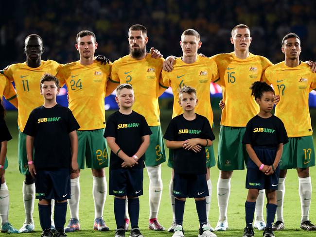 SYDNEY, AUSTRALIA - MARCH 24: Australian players stand for the national anthem during the International Friendly match between the Australia Socceroos and Ecuador at CommBank Stadium at CommBank Stadium on March 24, 2023 in Sydney, Australia. (Photo by Brendon Thorne/Getty Images)