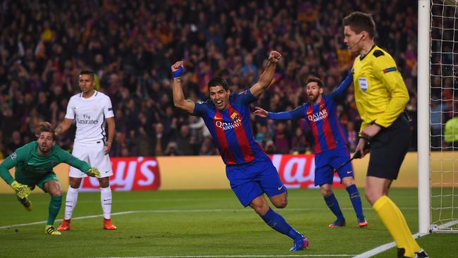 Suarez (C) celebrates after scoring the opener.