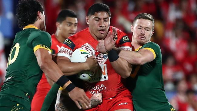 Jason Taumalolo of Tonga (C) is tackled by Australian players during the rugby league international Test match between Australia and Tonga at Mt Smart Stadium in Auckland on October 20, 2018. (Photo by Fiona Goodall / AFP)