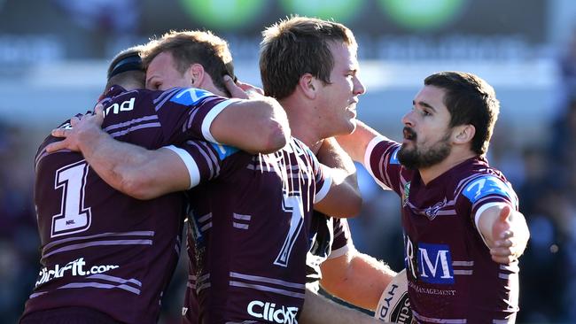 Jake Trbojevic (2nd right) of the Sea Eagles is congratulated by Daly Cherry-Evans, Cameron Cullen (right) and Tom Trbojevic (left) after scoring try during the round 19 NRL match between the Manly Sea Eagles and the West Tigers at Lottoland in Sydney on Sunday, July 16, 2017. (AAP Image/Paul Miller) NO ARCHIVING, EDITORIAL USE ONLY