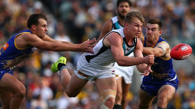 Ollie Wines gets his handball away for Port Adelaide against the West Coast Eagles. Picture: Paul Kane (Getty Images)