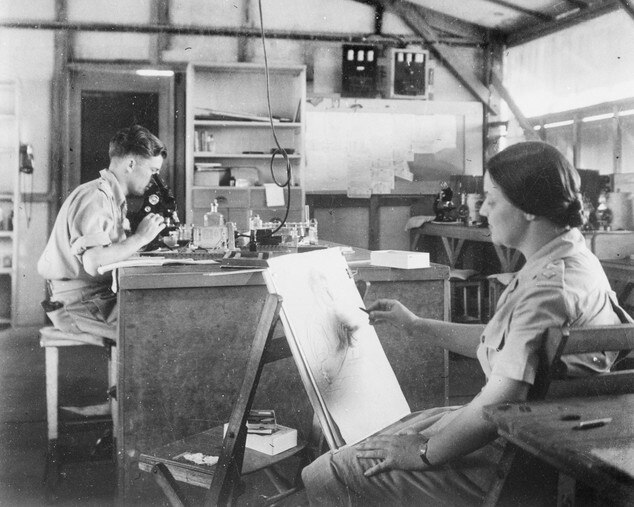 Nora Heysen during her time as an official Australian war artist. She is drawing assistant pathologist Lieutenant Max Swan at a Malaria Research Unit in Queensland. Picture: supplied 