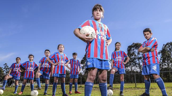 Nicola, 10, with fellow players from Templestowe United Football Club. Picture: Wayne Taylor.