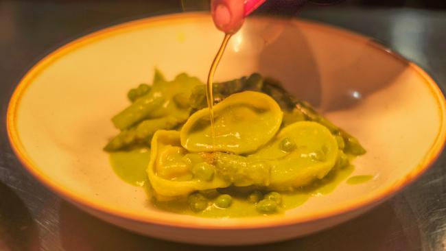 Caramelised onion and ricotta tortelli with peas and asparagus. Picture: Supplied