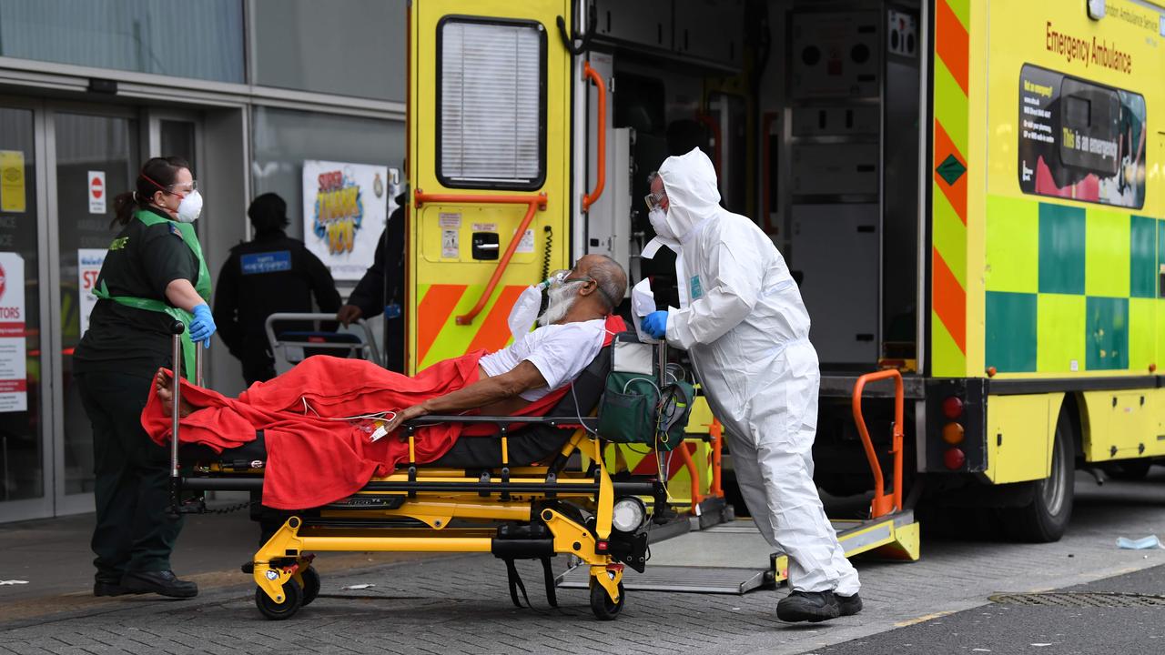 Paramedics wheel a patient into the Royal London Hospital. Picture: Daniel Leal-Olivas/AFP