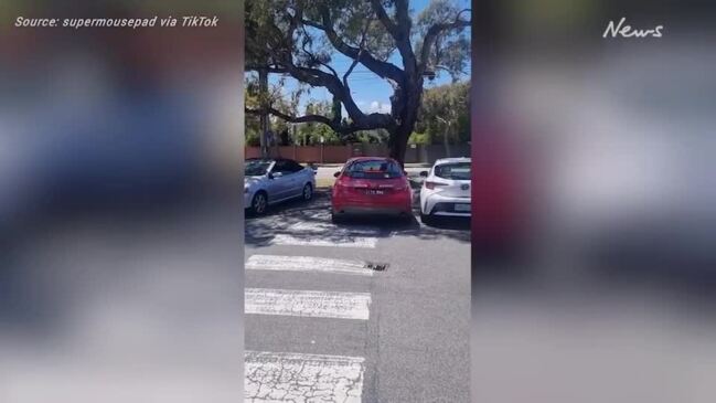 Horror moment tradie slams into parked cars