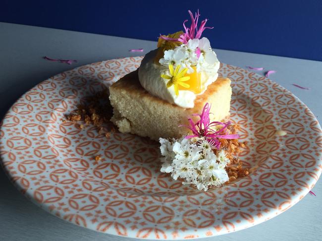 Pastel de tres leches is florally adorned.