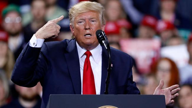 President Trump speaks during a Keep America Great rally in Michigan during the impeachment vote. Picture: AFP