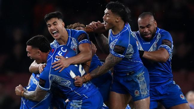 Samoan players celebrate their thrilling win against England. Picture: Gareth Copley/Getty Images