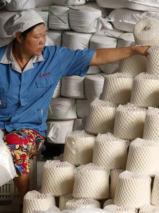 A worker at a textile factory in Huaibei. Pic: AFP.