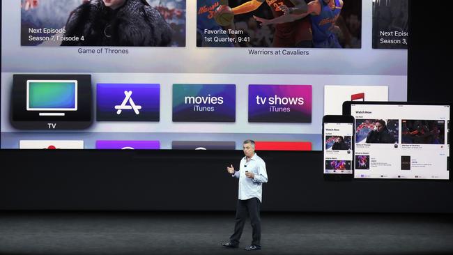 Eddy Cue, Apple's senior vice president of internet software, shows the new Apple TV product at the Steve Jobs Theater. Picture: AP Photo/Marcio Jose Sanchez