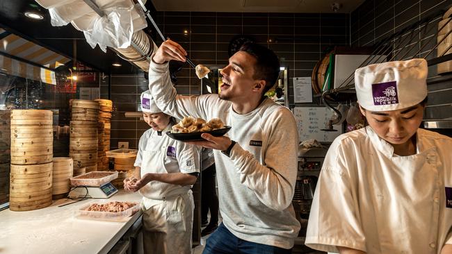 Kitchen Republik customer Joel Spear tries some dumplings ahead of this weekend’s competition. Picture: Mark Dadswell
