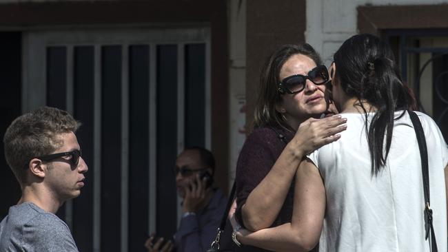 Grieving relatives of passengers  wait outside a services hall at Cairo airport.