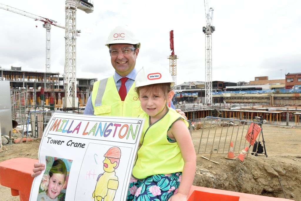 MY CRANE: Milla Langton has her drawing selected for the latest crane in the QIC development and proudle shows Grand Central centre manager Shaine Beverage. Picture: Bev Lacey