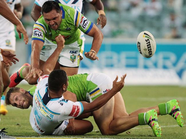 Titans outside back Nene MacDonald offloads the ball against the Raiders last weekend. Picture: Getty Images