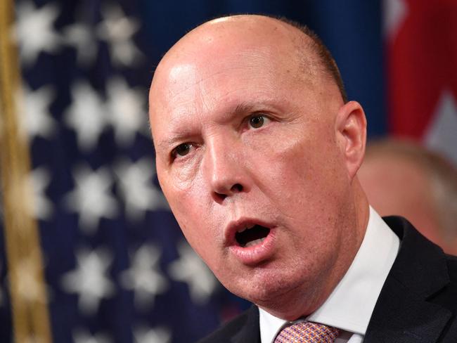 (FILES) A file photo taken on March 5, 2020 shows Australia's then-Home Affairs Minister Peter Dutton during a press conference at the Department of Justice in Washington, DC. - Dutton, who became Australia's new defence minister on March 29, 2021, is a hardline ex-cop who has overseen a controversial refugee policy, riled close ally New Zealand by deporting criminal Kiwis and publicly clashed with the Chinese government. (Photo by Mandel NGAN / AFP)