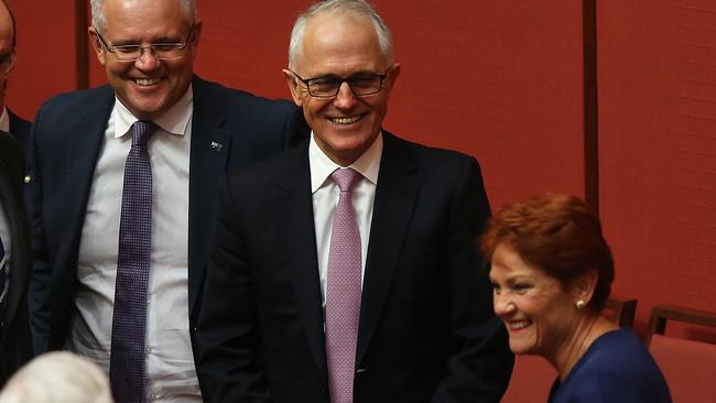 Senator Pauline Hanson talks to Malcolm Turnbull after Senator Jim Molan delivered his Maiden speech in the Senate Chamber..