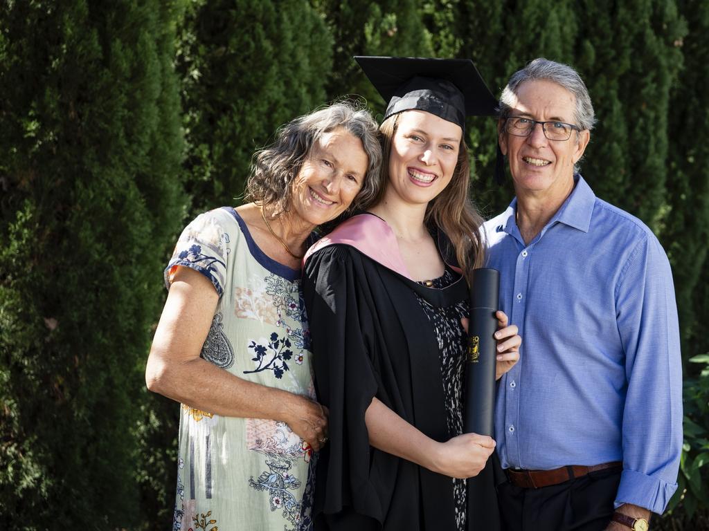 Bachelor of Education (Primary) graduate Sarah Hummerston is congratulated by parents Janet and Bruce Hummerston at a UniSQ graduation ceremony at Empire Theatres, Tuesday, June 27, 2023. Picture: Kevin Farmer