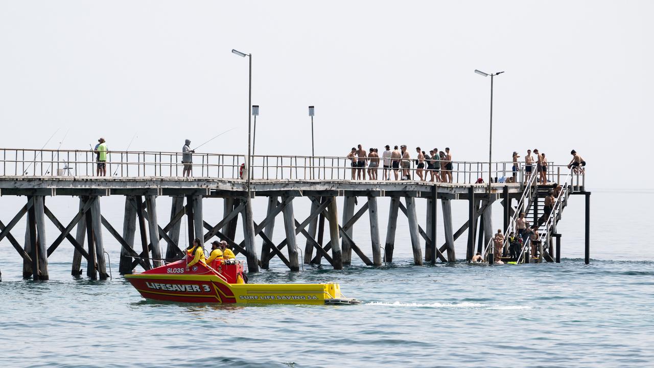 Surf life savers patrol Port Noarlunga Beach after the reported attack. Picture: NCA NewsWire / Morgan Sette