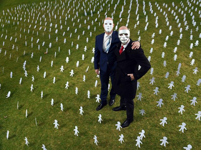 30/06/19 - Masked brothers "A" and "B" ahead of the final appeal hearing for sex predator Vivian Deboo. Surrounded by paper cut outs symbolising other victims who need help..Picture: Tom Huntley