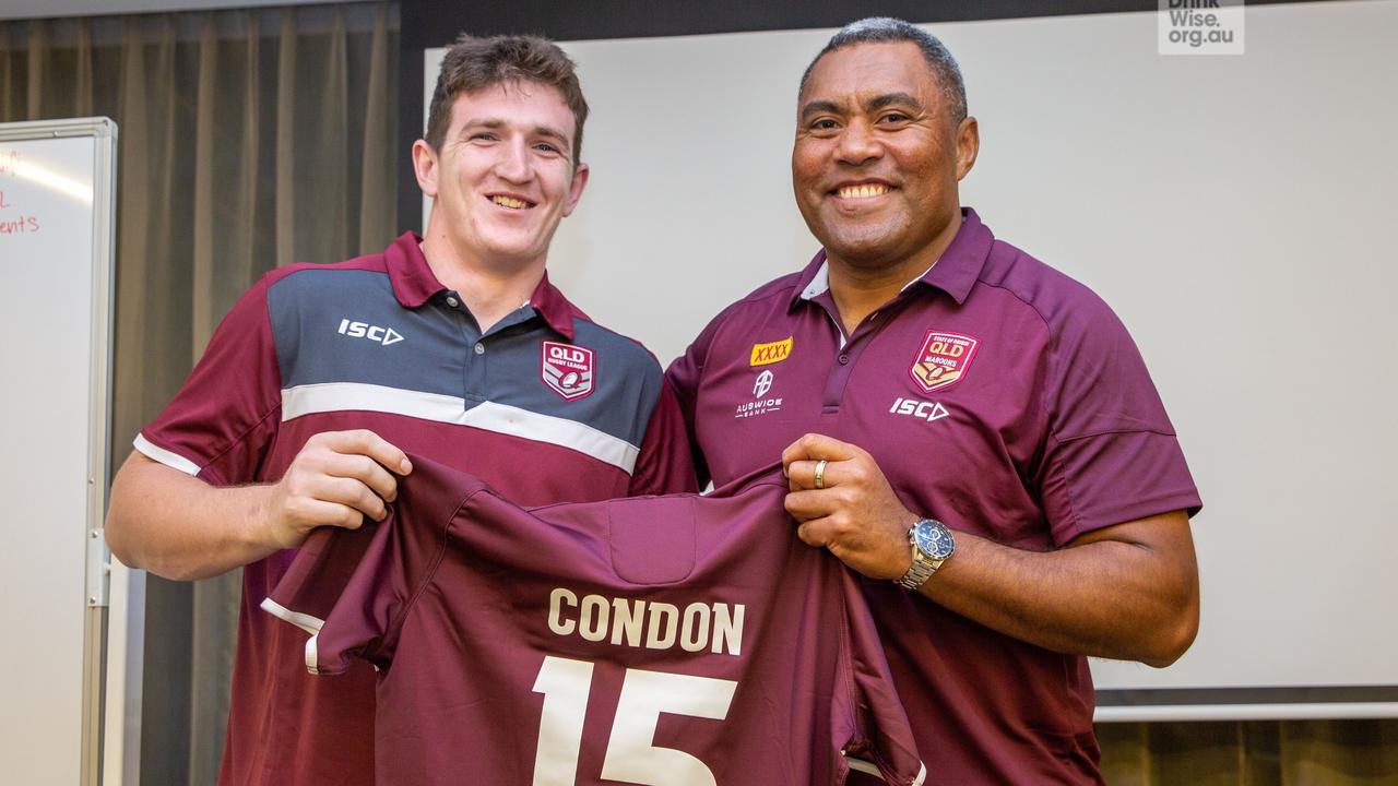 Ben Condon receiving his Queensland under-20 jersey from league legend Petero Civoniceva.